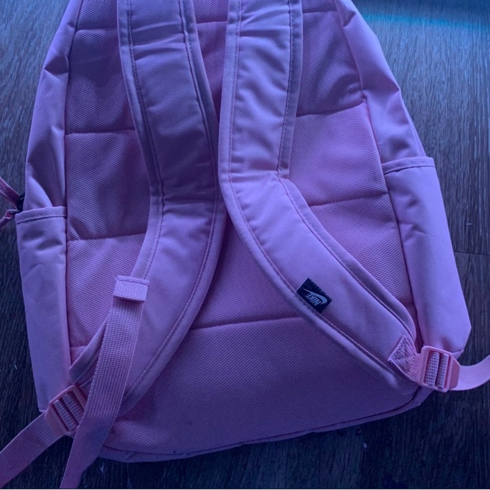 A pink Nike backpack